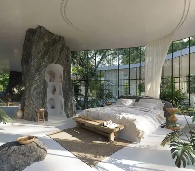 Dormitorio con una gran roca, paredes de vidrio y plantas alrededor de la cama